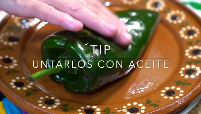 Roast the poblano peppers to make them easier to peel. Place them in a plastic bag to sweat, then peel, seed, and cut into strips.