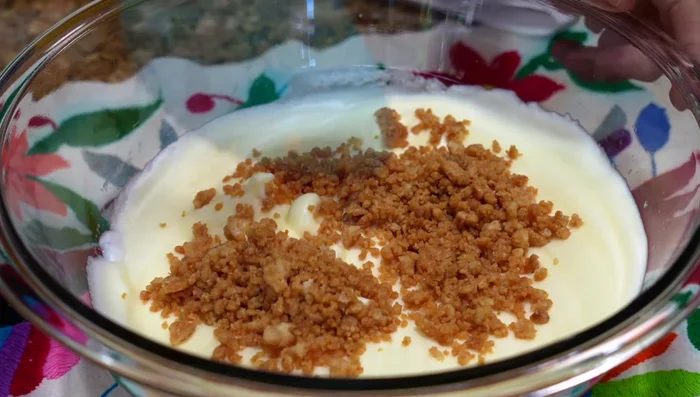 Gradually add the pork rind mixture to the egg mixture, gently folding until combined.
