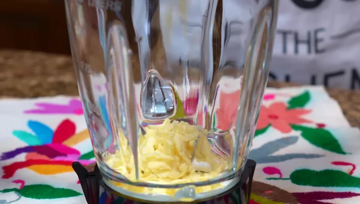 Blend cream cheese, grated cheese, Mexican crema, roasted bell pepper, and the cooked tomato sauce.