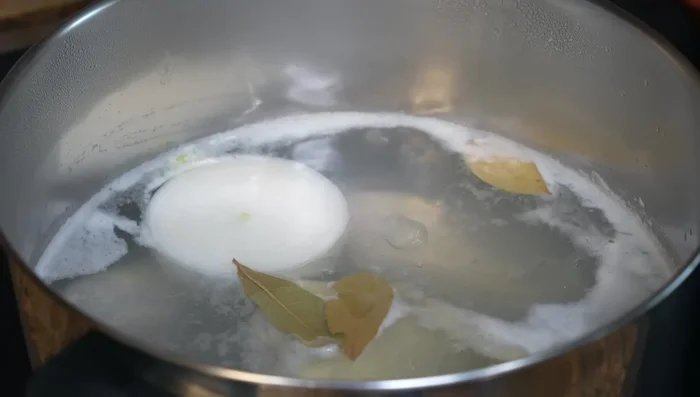 Cook chicken until tender. Remove skin and shred.
