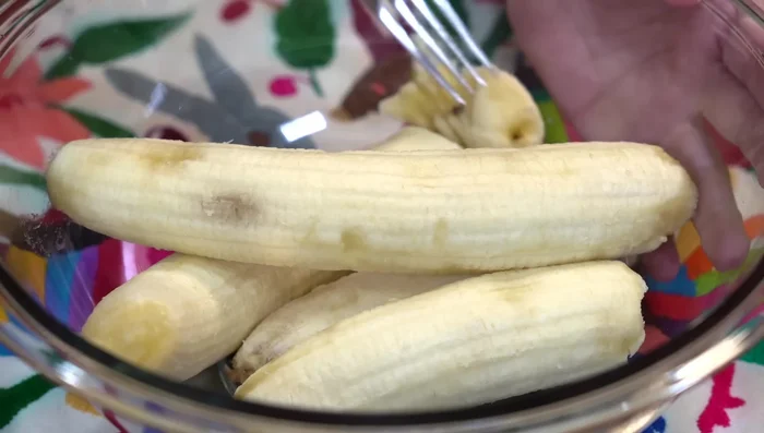 Mash plantains: Mash ripe plantains in a separate bowl.