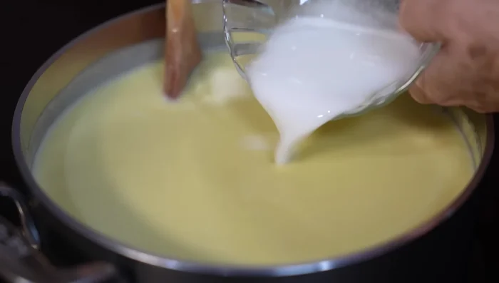 Stir in the cornstarch slurry (cornstarch dissolved in cold water).