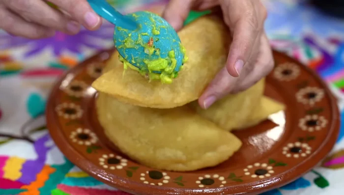 Serve: Serve the empanadas with guacamole and green sauce.