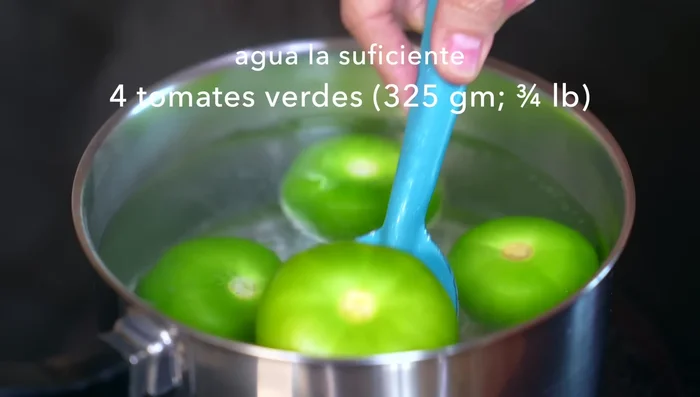 Bring enough water to a boil. Add green tomatoes and zucchini. Cook until tomatoes change color and soften (about 10 minutes). Let cool.