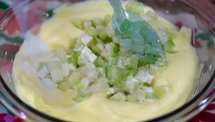 Incorporate the chayote and cheese mixture gently.