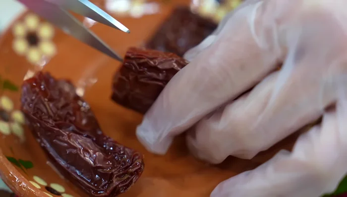 Remove seeds and veins from the chiles (optional).