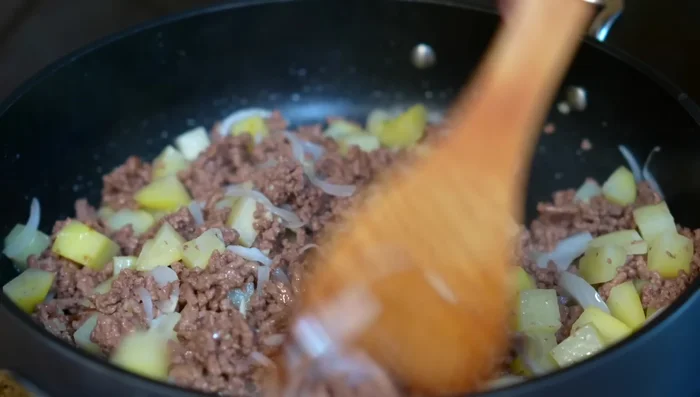 Add the prepared red sauce, add water if needed for desired consistency. Season with salt or chicken broth powder. Simmer covered for 10 minutes.