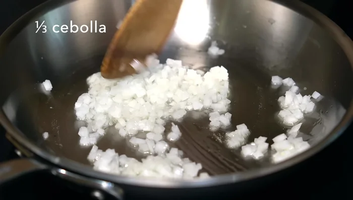 Prepare Infladitas Filling: Sauté onion, garlic, and serrano pepper. Add beans and chorizo/longaniza, crushing the beans.