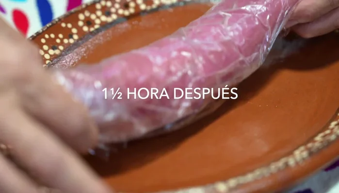 Slice the partially frozen pork loin into thin slices.
