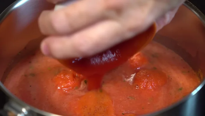 Add the tomato puree and continue to cook until the flavors are integrated (about 15 minutes). Turn off the heat and let cool. To cool faster, place the sauce in a container with ice water.