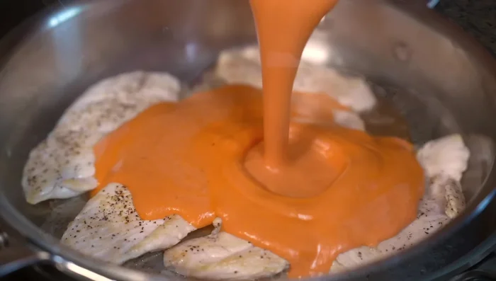 Add the chipotle cream sauce to the pan, lower the heat, and simmer until heated through.