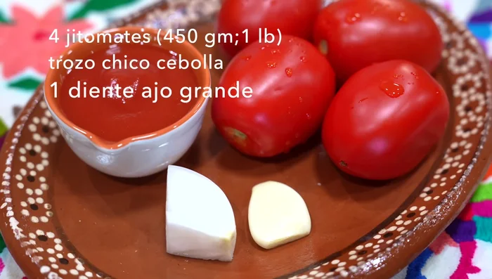 Blend 4 ripe tomatoes, a small piece of onion, a large clove of garlic, and 1/2 cup of canned tomato puree. Strain the mixture.