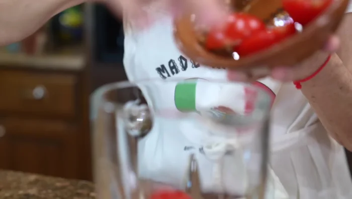 Blend raw tomatoes, chipotle pepper, chicken broth in a blender.