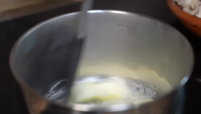Melt butter in a saucepan, add mushrooms, salt, and cook until liquid evaporates and mushrooms caramelize (7-8 mins).