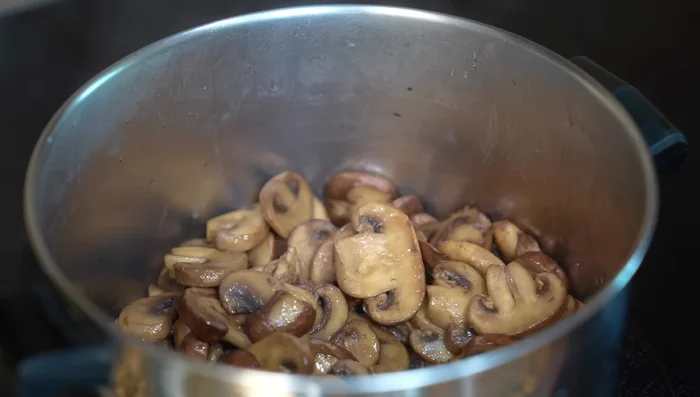 Add onion, garlic, thyme, and bay leaf to the mushrooms; cook until onion is sautéed (5 mins).