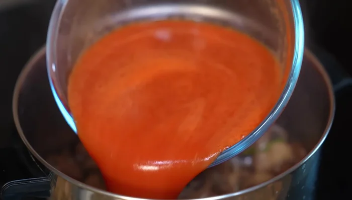 Add the blended tomato mixture, chicken bouillon powder, and simmer (15 mins).