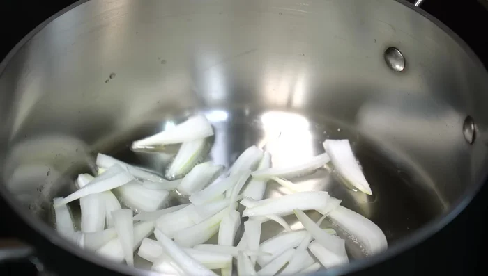 Sauté onion and corn in hot oil.