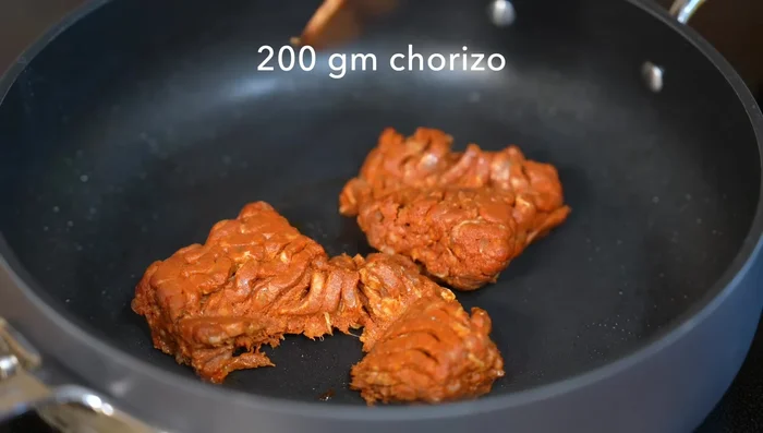 Fry the chorizo until it crumbles and the fat renders. Remove the chorizo and set aside.