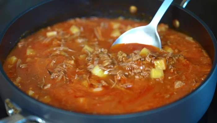 Continue to simmer until the potatoes are cooked through. Serve hot with warm corn tortillas and rice.