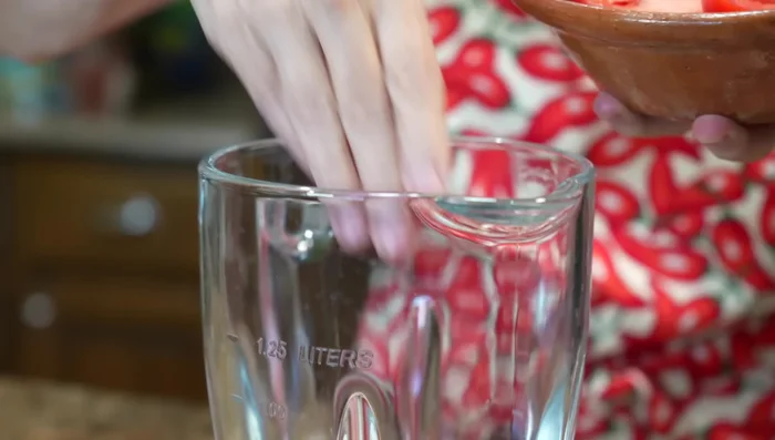 Blend ripe tomatoes until smooth.