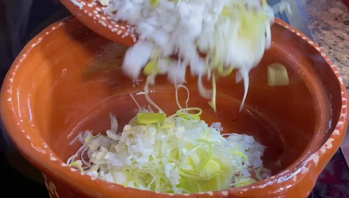 Heat oil in a pot. Sauté onion, leek, and garlic until softened (6-7 minutes).