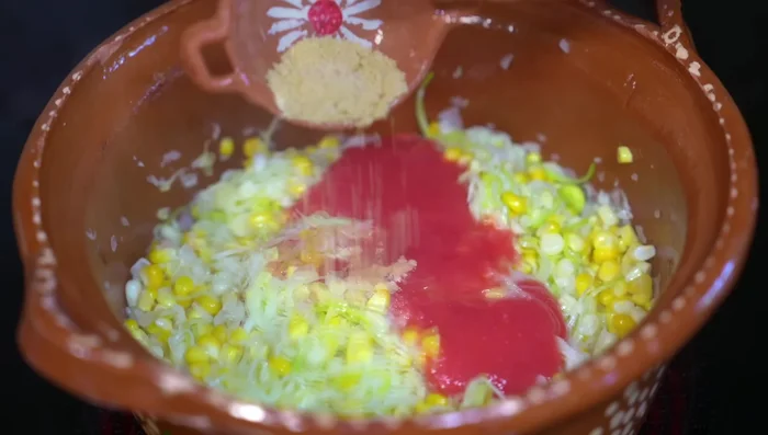 Add blended tomatoes, salt or chicken broth powder, and cook for 5 minutes.