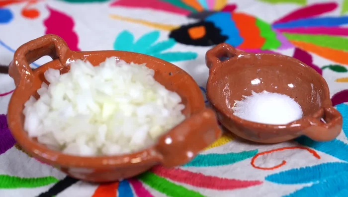 Finely chop half an onion.