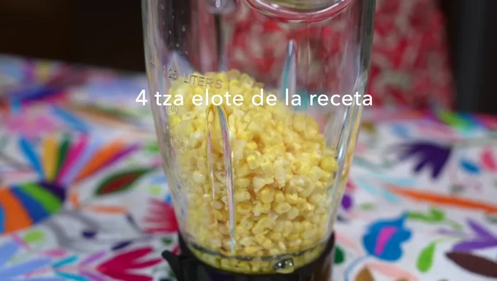 In a blender, combine four cups of the corn, one cup of milk, and salt. Blend until smooth, then strain.