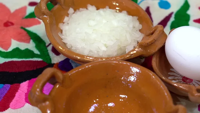 While potatoes cook, sauté chopped onion until lightly golden brown.