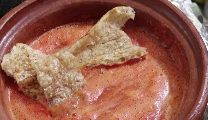 Add the cut pork rinds to the saucepan.