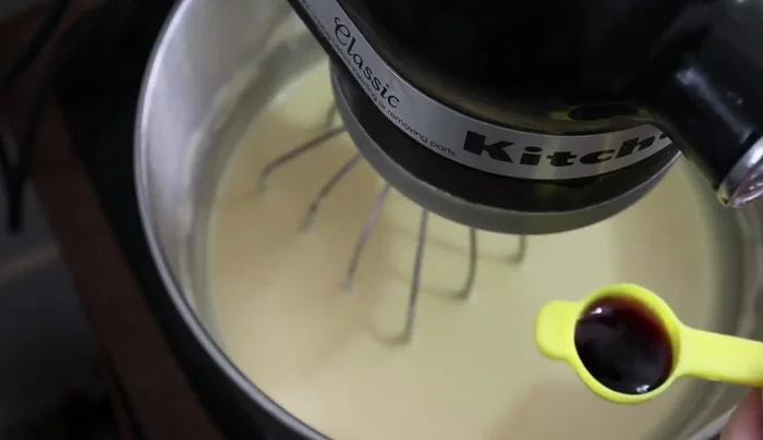 Add 2 tablespoons of vanilla extract and beat for another minute.