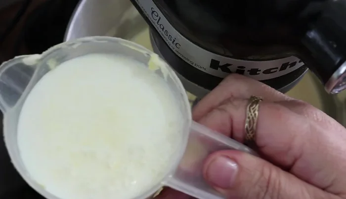 Add 1 cup of milk in a thin stream while beating.