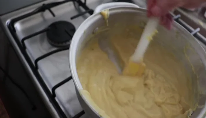 Continue stirring until the cream thickens significantly and pulls away from the sides of the pan.