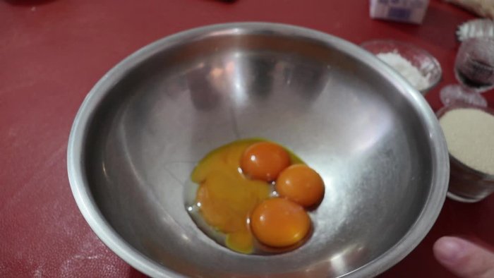 Place four egg yolks (without the whites) in a bowl.