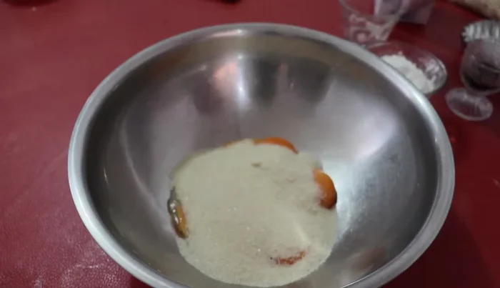 Add half a cup of sugar and beat until well combined.