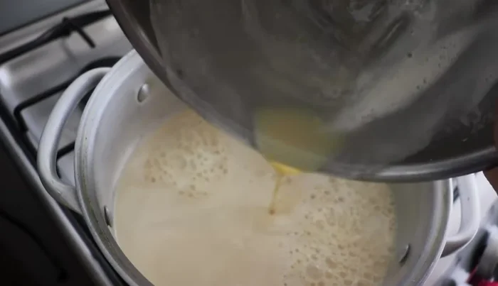 Pour the mixture into a saucepan, add cinnamon, and stir constantly until it boils. Do not leave unattended to prevent sticking.