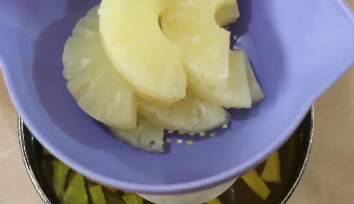 Layer the rest of the pineapple and cherries in the semi-set pineapple gelatin.