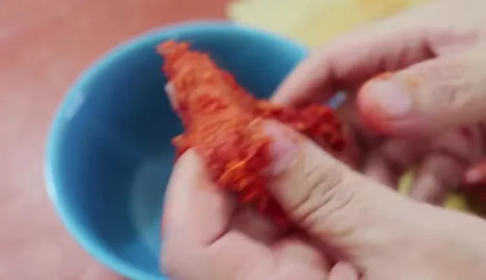 Remove the casing from the chorizo.