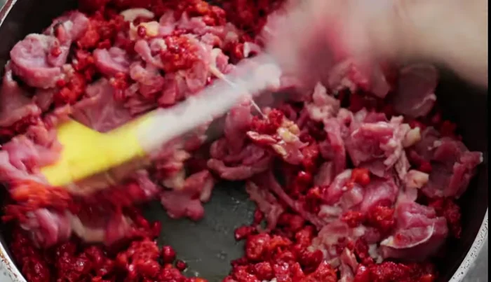 Add the steak to the pan and stir to combine with the chorizo.