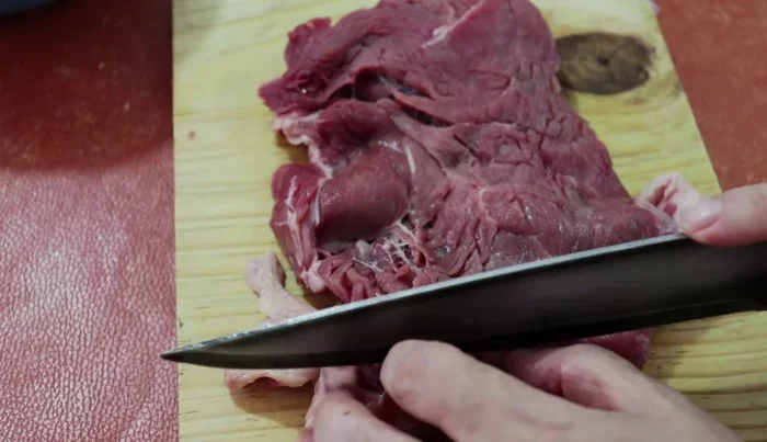 Cut the steak into small pieces.