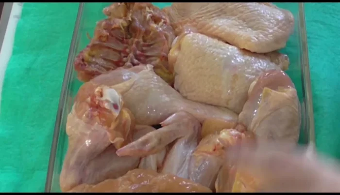 Place the whole chicken or chicken pieces in a baking dish. Pour the marinade over the chicken, add salt to taste, and let it marinate for 10 minutes.