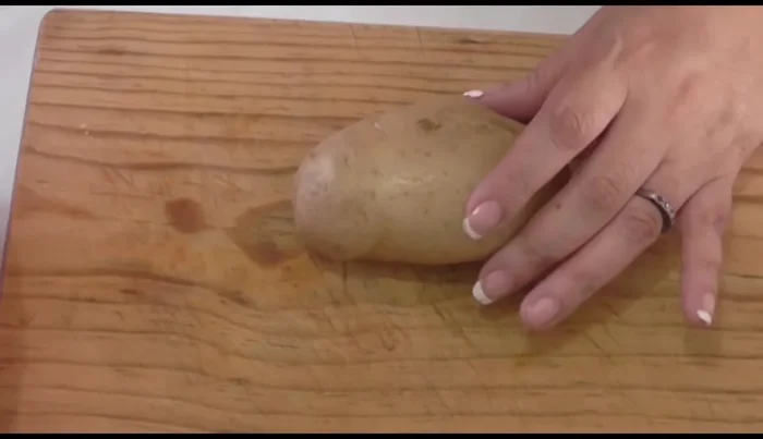 Drain and cut the cooked potatoes in half lengthwise.