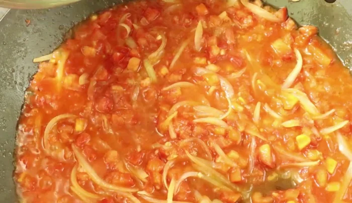 Add the bell peppers and herbs. Add 1 cup of water and stir in.