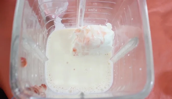 In a blender, combine Philadelphia cream cheese, evaporated milk, strawberry jam, half-and-half, and condensed milk (in two batches if necessary). Blend until smooth. (95.34)