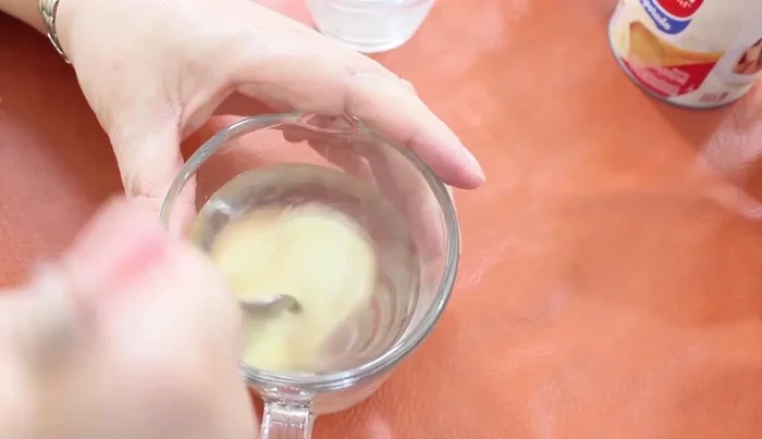 Bloom the unflavored gelatin in cold water until it softens like a sponge. (70.56)