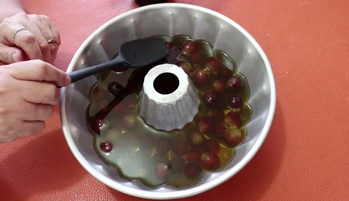 Carefully add the three-milks mixture to the semi-set gelatin, gently tapping the mold to prevent spoiling. (260.04)