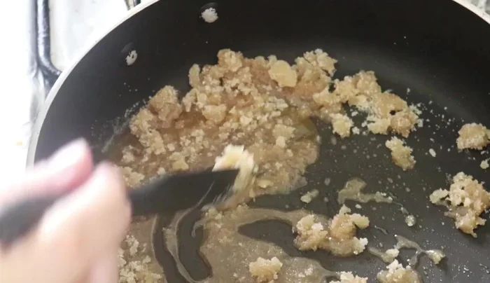 In a pan, melt sugar over medium heat to create caramel. Be careful not to burn the sugar.
