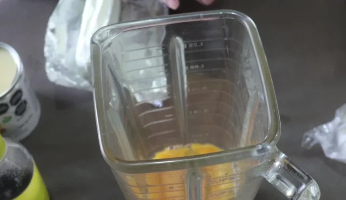 Place eggs, cream cheese, vanilla, evaporated milk, condensed milk, and half-and-half cream in a blender and blend until smooth.