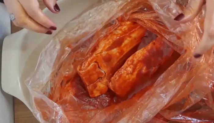 Preheat oven to 200-250°C (392-482°F). Place marinated chamorros in a refractory dish or aluminum tray, inside the bag. Bake for 2-3 hours, checking every half hour.