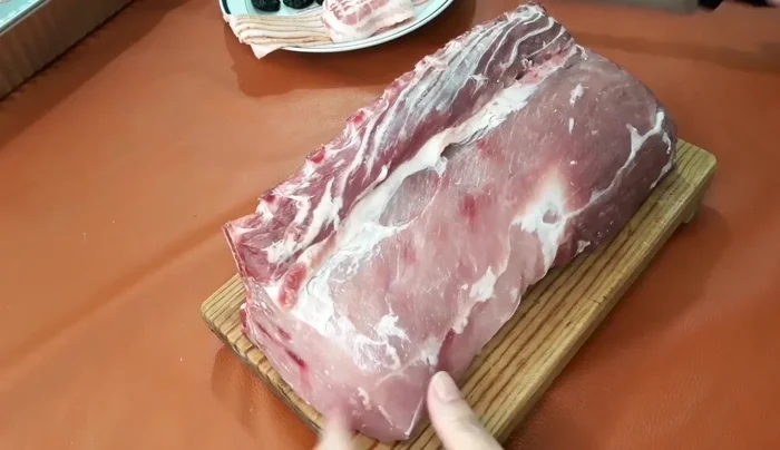 Prepare the pork loin: Chop the loin to allow for easier stuffing. (92.2)